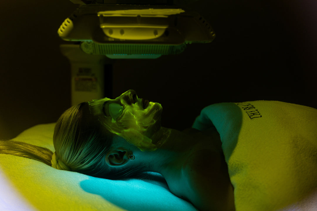 Woman receiving an LED facial treatment at The Beauty Embassy Gold Coast